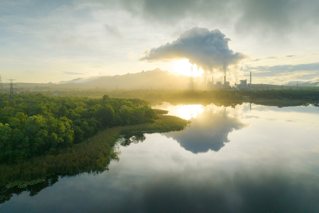 Aerial view coal power plant station in the morning mist, the morning sunrises. coal power plant and environment concept. Coal and steam. 