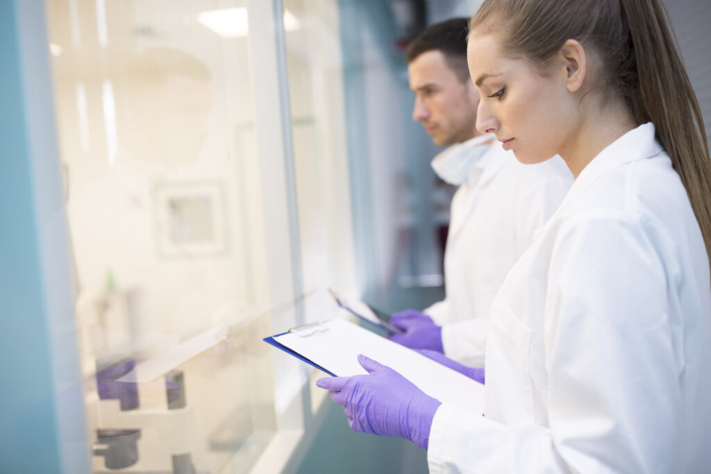 man-and-woman-in-lab-coats-with-clipboards